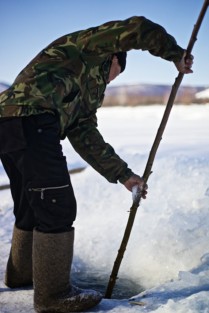 Ice fisherman, Oymyakom, Yakutia, Siberia, Russia