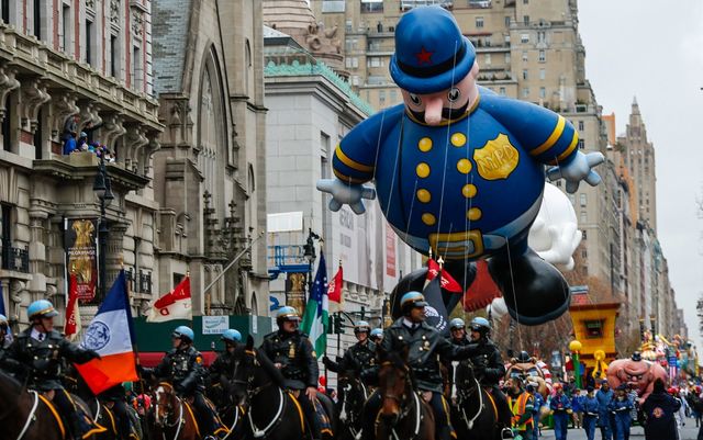 Keystone Cop balloon floats down Central Park West during the 88th Macy's Thanksgiving Day Parade in New York